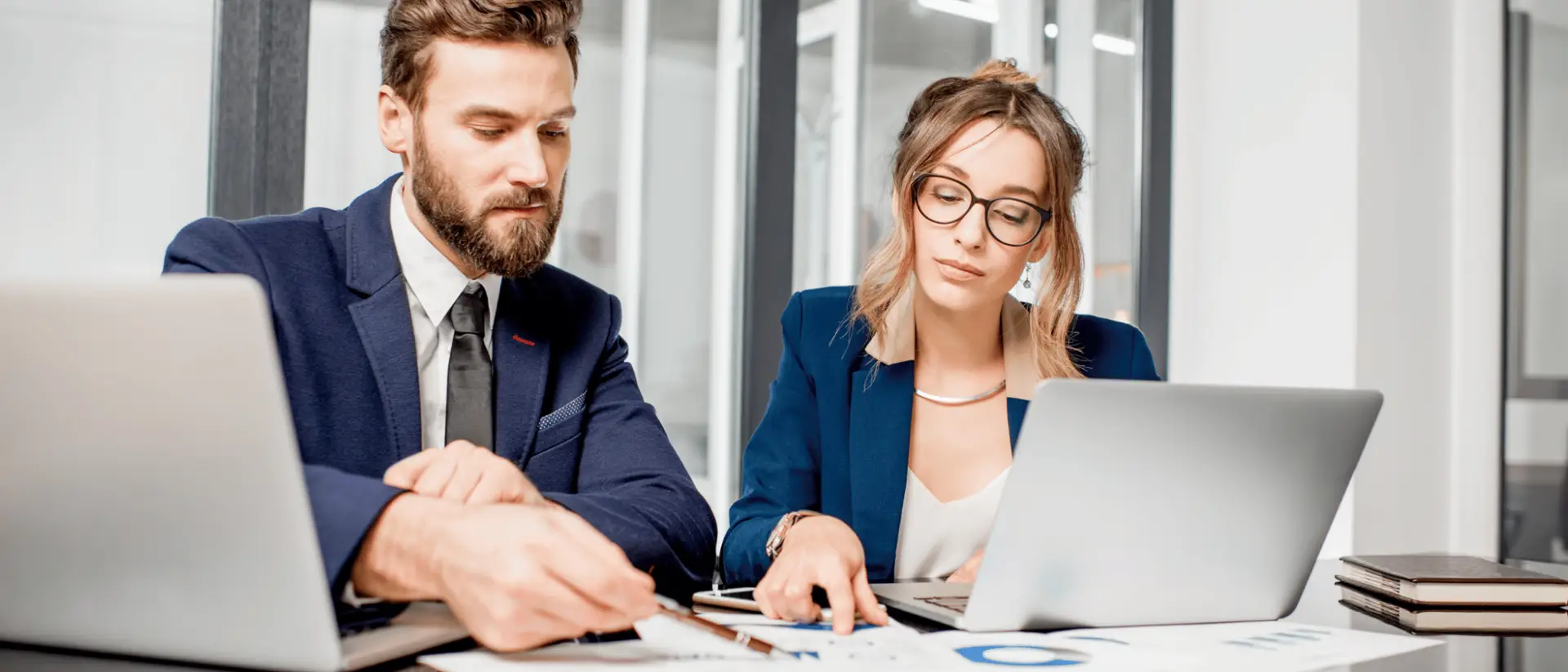 Arizzon Capital's accounting and legal team reviewing a client file to determine the success of implementing a new business strategy.